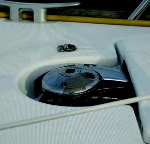 The aft end of the sprit latches into a pad eye placed almost invisibly on the foredeck. The strength under this fitting must be confirmed before drilling holes.