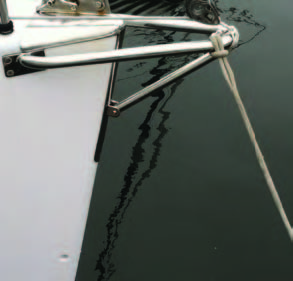 owsprits need not be huge, complicated affairs. This simple fabrication suffices to keep the A-sail away from the bow rail-and the nav lights. The latter are commonly mounted on a piece of stainless steel with not-so-dull edges.