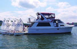 Committee boats, owned and skippered by Northport Yacht Club members, have served as spectator vessels, rain shelters, lunchrooms and First Aid stations. © Peggy Doherty