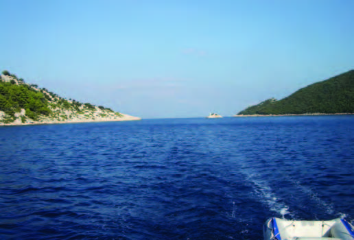 The narrow passage between Mljet (on the right) and Kobravce, with a little lighthouse just to the right of center.jpg