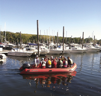 Sailors head out to Captain’s Cove Island Dock with SAIL BLACK ROCK Coach Jamie Fales. © Dave White