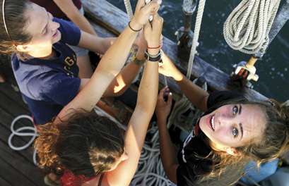 Sisters Under Sail participants haul away aboard the Tall Ship Unicorn