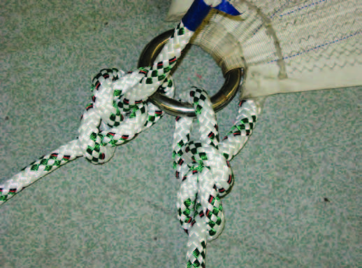 Tying bowlines into the clew is fast and easy, but creates bulk that hangs up in the stay when tacking. This often makes it a long grind to get the sail in after a tack.