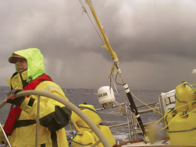 Whether racing down to Bermuda or sailing home, it can be windy and wet. Bring your wet gear, hook on, and be alert. Pictured here is Chip Adams at the helm of Brian Swiggett’s Hinckley Sou’wester 42 Zest. © John Rousmaniere